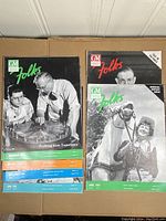 Full set of vintage GM Folks Company magazines with colorful covers and visible titles on spines.