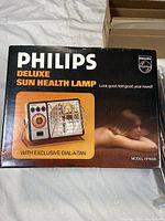 Box of Philips Deluxe Sun Health Lamp Model HP4000 showing front with product image and branding
