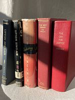Five hardcover Upton Sinclair books standing side by side showing various bindings and dust jackets.