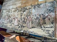 Full view of the woven textile panel showing Victorian courtyard dancing scene and mounted with brass hanging hooks.