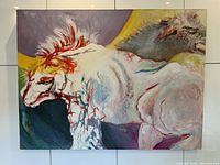 Full view of the painting hung on a white tiled wall