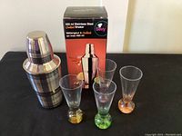 Cocktail shaker with original box and four glasses with colored bubble bases
