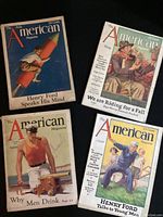 Four vintage issues of The American Magazine laid out on black surface, showing front covers with distinctive illustrations and headlines.