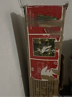 Box of the Christmas tree shows branding as Target Stores, with an image of a decorated cashmere pine tree and snowman figure.