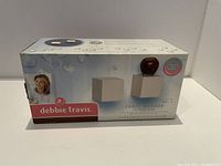 Box of Debbie Travis Shelf Cubes, showing packaging with product image and branding.