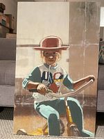 Front view of painting showing child wearing hat sitting on tricycle with neutral-toned background.