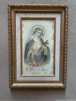 Frontal image showing framed religious artwork of St. Rosa de Lima.