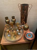 Overview of all brass and copper items on a wooden surface