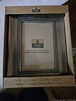 Photo of unopened Governor's Collection album frame in original box showing front and sides of packaging