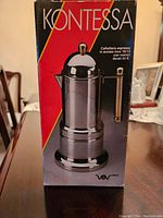 Photo of boxed Kontessa espresso pot showing the brand and packaging details.