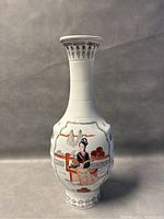 Front view of the tall eggshell porcelain vase showing a woman seated on a bench wearing traditional attire, holding a fan, surrounded by floral elements and landscape details.