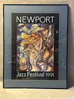 Full view of the framed colorful abstract jazz festival poster with trumpet and saxophone players, titled 'NEWPORT Jazz Festival 1991'.