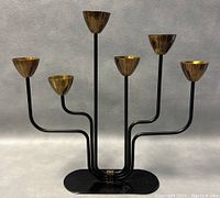 Front view of six-arm candleholder showing overall design and arm arrangement