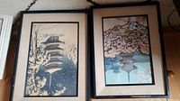 Both framed prints side by side on floor