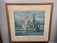 Full view of framed art print showing landscape rock formation and pine tree in muted tones.