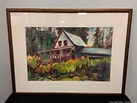 Full view of the framed watercolour painting showing the house with greenery and trees.