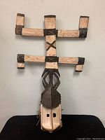 Front view of Dogon Kanaga tribal dance mask showing full structure and colors.