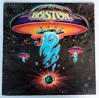 Front cover of Boston's self titled debut album showing spaceship artwork with band name.