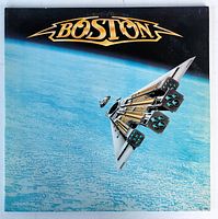 Front cover of Boston Third Stage LP showing spaceship artwork and band logo.