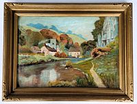 Framed oil painting showing the full artwork with a riverside village and natural landscape with vintage wooden frame.
