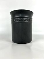 Front view of Le Creuset matte slate grey utensil pot showing 'LE CREUSET' embossed branding on the upper band.
