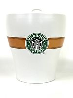 Front view of the white ceramic Starbucks coffee canister with logo and brown stripe.