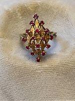 Top view of ring showing marquise cluster design and ruby arrangement