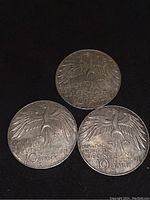 Three 1972 D German 10 Mark silver coins showing the eagle side with inscriptions.