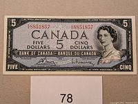 Front view of 1954 Canadian $5 banknote showing Queen Elizabeth II portrait and serial number 8851857.
