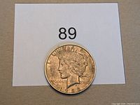 Obverse side of 1923 Peace Dollar coin showing Lady Liberty profile, date, and 'LIBERTY' inscription.