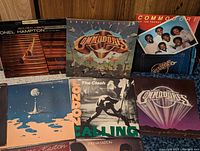 Close-up image showing Commodores Greatest Hits and other albums with visible cover details.