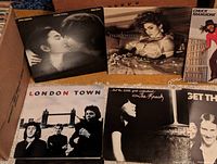 Top view showing John Lennon & Yoko Ono Double Fantasy, Madonna True Blue, London Town, The Knack album covers, and Chuck Mangione Vivevo Fun and Games partially visible.