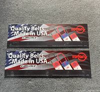 Two rectangular plastic Rotary belt signs, measuring 12 x 36 inches, featuring American flag background and product images.