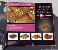 Photo of the box showing the Chicago Metallic branding and showing features like 12 perfectly cut brownies, separable inserts for easy removal and serving.