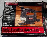 Box of Craftsman Auto-Scrolling Saber Saw showing product details and condition