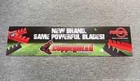 Full view of the Rotary Copperhead lawn mower blades sign showing blade graphics and branding text.