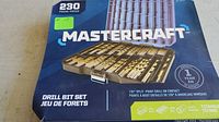 Front of Mastercraft drill bit set box showing 230 pieces, 135° split point drill bit design and titanium coating, 1 year warranty badge