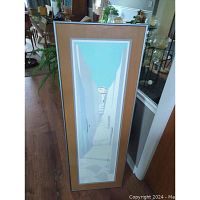 Full view of the framed 'Athens Steps' print standing on floor showing narrow vertical artwork and frame details.
