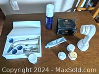 Overview of all items including beauty device, creams, and massager