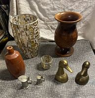 Full lot displayed on gray textured surface with cream fabric background, showing all items grouped together