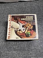 Top view of original box for KitchenAid Food Grinder Attachment Model FG-A showing product image and branding.