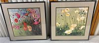 Pair of two framed floral prints with glass, one with vibrant colorful flowers and the other with white/yellow flowers.