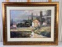 Full view of framed countryside and cottage print showing the entire artwork and frame.