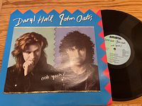 Front cover of the vinyl record album 'Ooh Yeah!' by Daryl Hall & John Oates showing artist portraits and record partially visible.