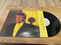 Photo of Rod Stewart 'Tonight I'm Yours' vinyl album cover, inner sleeve, and record disc partially visible.