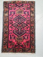 Full view of the Persian Ardebil rug showing the entire design and color palette.