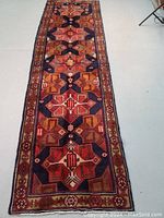 Full-length view of the runner showing overall geometric medallion pattern and color palette