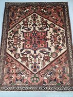 Full top view of the rectangular rug showing central medallion, geometric motifs, color palette and overall layout.