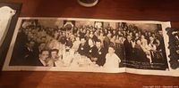 Photo showing a wide group shot of magicians and guests seated at banquet tables at the 1947 International Brotherhood of Magicians Hat and Rabbit Club Ladies Night event.