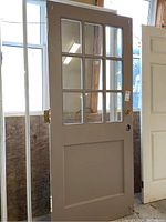 Front view of the door highlighting the six glass panes and lower solid panel.